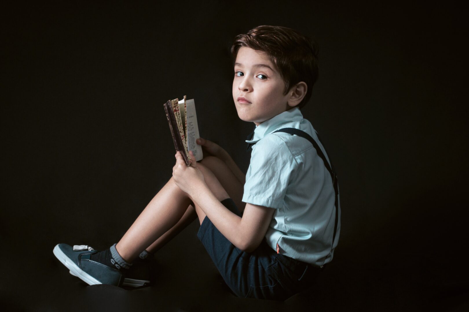 A Boy Reading a Book captured by Canon T7